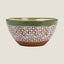 A ceramic bowl with a textured pattern, featuring a glossy olive green interior and rim, a white middle section covered in small brown leaf-like speckles, and a solid terracotta brown base.