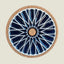 Round coaster with blue geometric design and cork back on a beige background