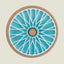Round coaster with blue geometric design and cork back on a beige background