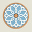 A round decorative wall hook or pegboard cover with a light blue glazed ceramic floral design, a white raised geometric overlay, and a natural cork border on a light beige background.