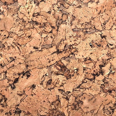 A close-up texture of cork material with a natural, organic pattern in shades of tan, brown, and beige.