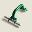 A green and silver metal J-roller for cork tiles shown on a solid light beige background.