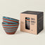 Three small striped ceramic bowls in terracotta and turquoise blue are shown next to their kraft paper packaging box by Salviaica Portugal.